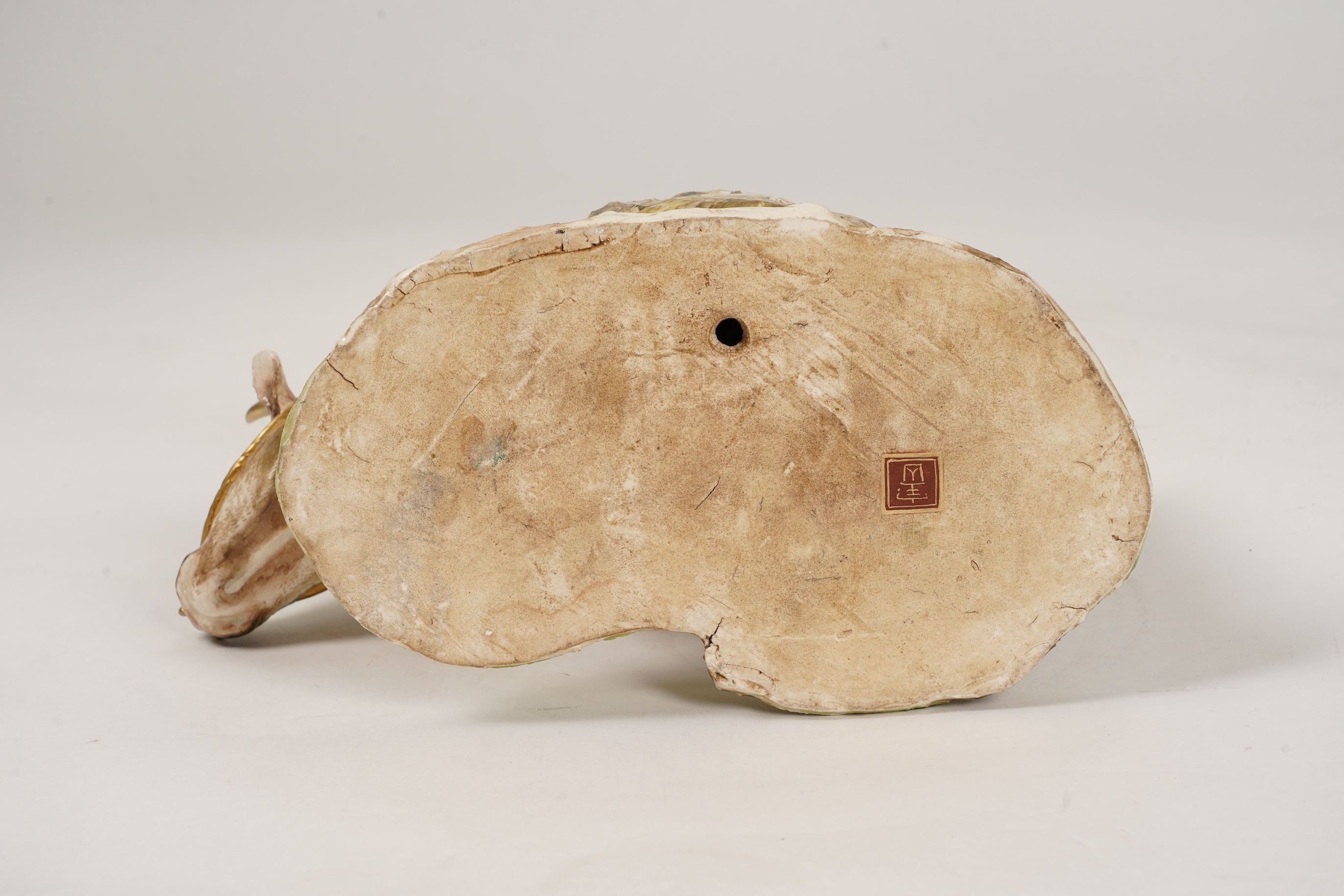 A large Japanese Satsuma model of boy riding on a buffalo, signed Hozan, Meiji period